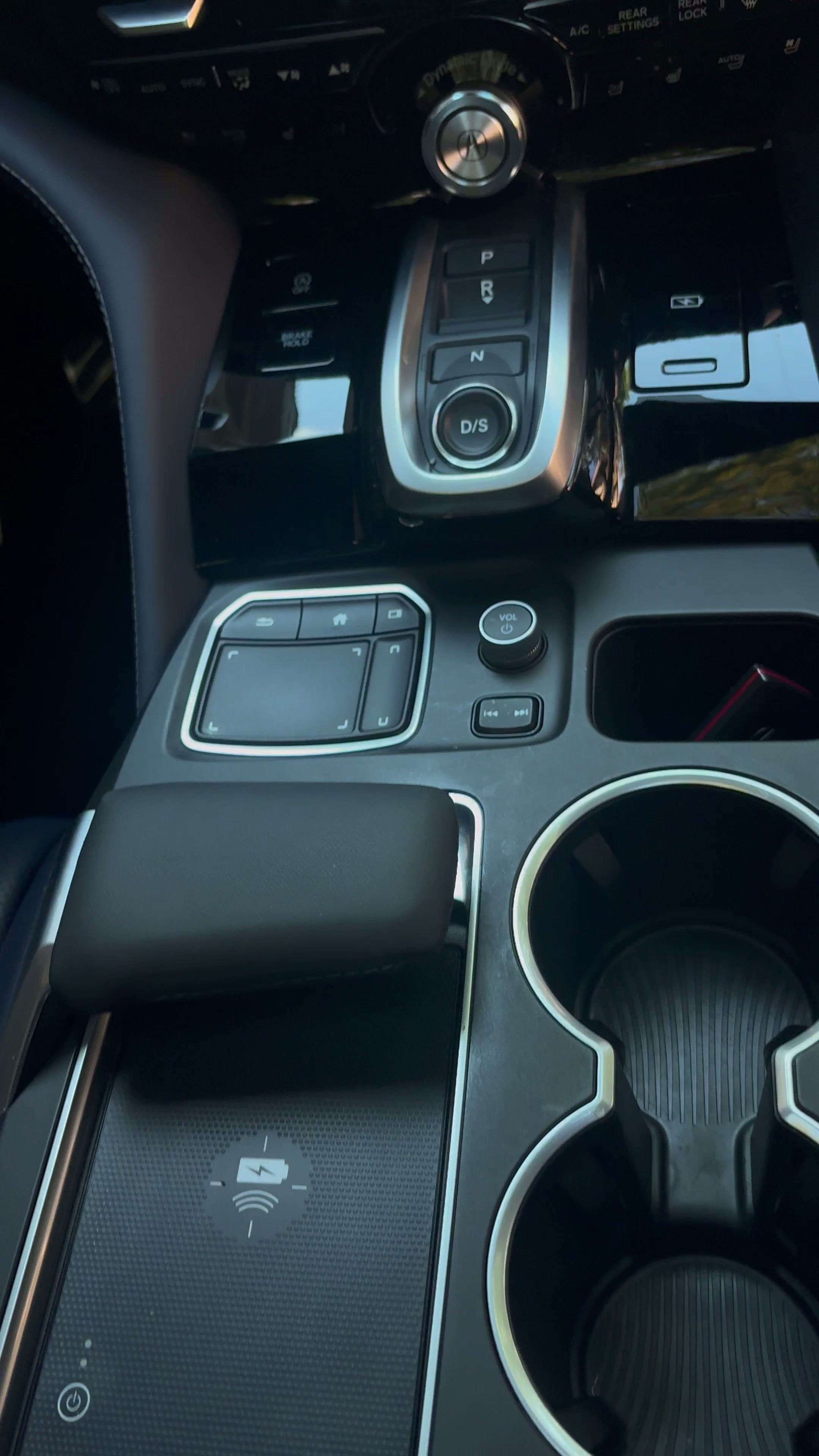 Spotless Acura interior console and cup holders after a full interior detail